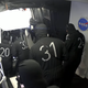 The SpaceX pad crew re-inspecting the seal shortly after having to reopen the hatch upon discovering FOD in the form of a human hair.